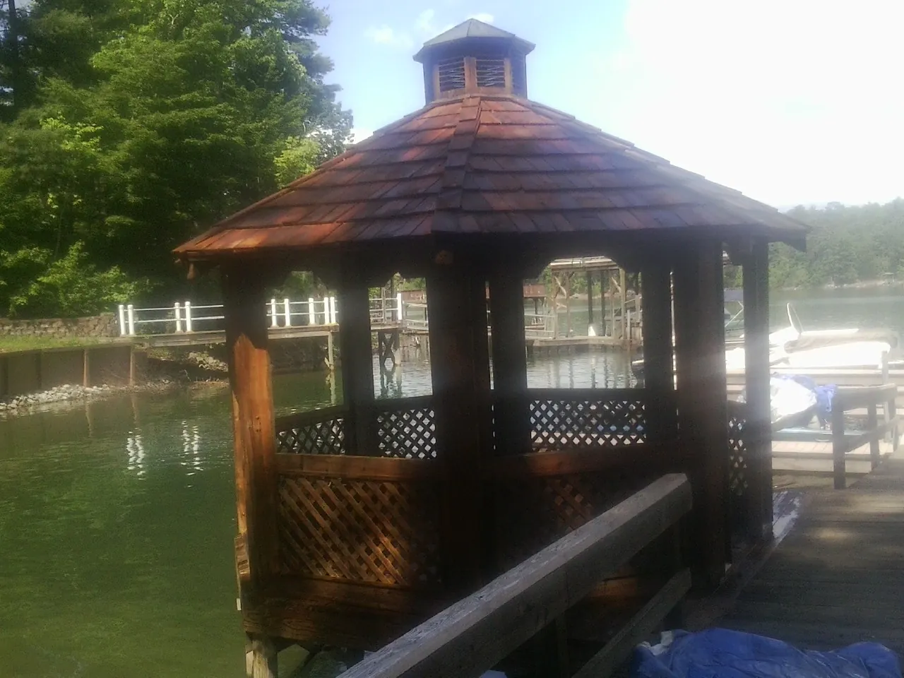 Cedar shake gazebo roof rebuilt on a lake dock in Lebo
